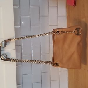 Michael Kors beige/tan pebble leather small shoulder bag.